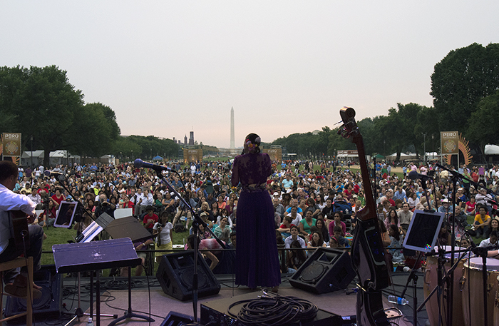 Julie Freundt performs with Marinera Viva!!! on the Ralph Rinzler Concert Stage, with the Q'eswachaka Bridge in the background. Photo by Ronald Villasante, Ralph Rinzler Folklife Archives
