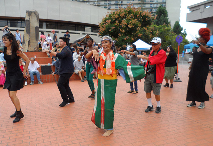 Nobuko Miyamoto leads the dance at the <em>FandangObon</em> and Mottainai “Eco” Fest, held at the Japanese American Cultural and Community Center’s Noguchi plaza, Little Tokyo, Los Angeles, 2015. Photo by Deborah Wong