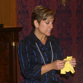 Mariela Melero shares the story of the doll she and her sister had to leave behind when they traveled to the United States from Cuba. She donated the doll’s tiny yellow shirt to the Smithsonian. Photo courtesy of Mariela Melero