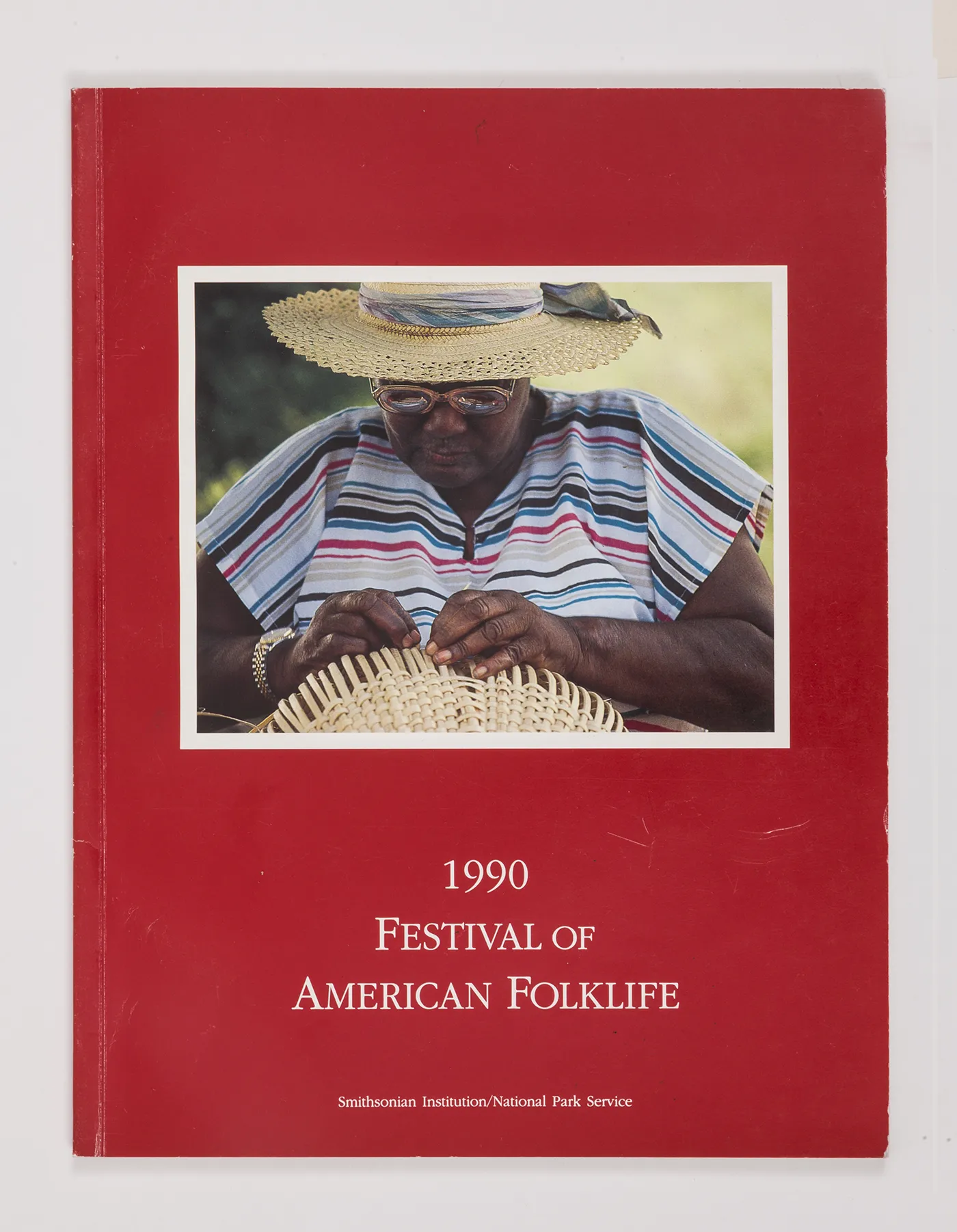 Basket weaver Felicia Caines was featured on the cover of the 1990 program book, bringing a different type of visibility to the Virgin Islands.