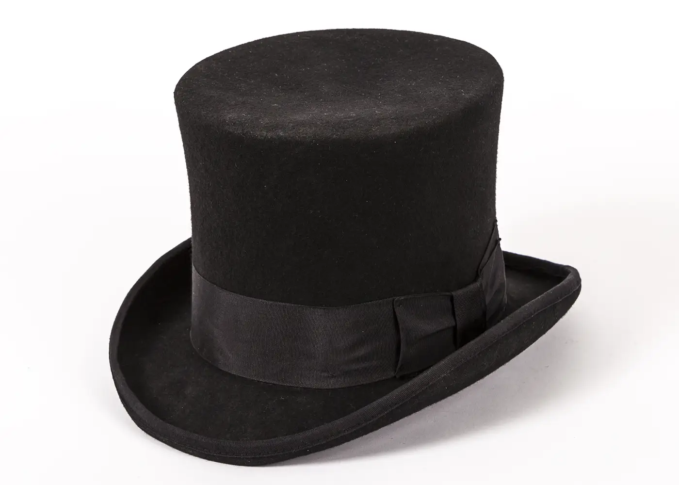 A black top hat with a broad black ribbon around the crown and ribbon-edged rim. 
