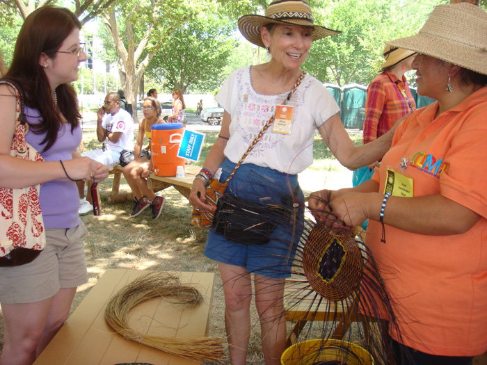 Colombia program curator Olivia Cadaval (center) with basket weaver Areli Hernández Vega (right) and a Festival visitor