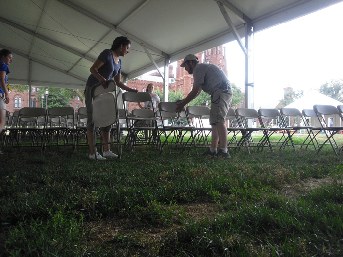 Setting up the seating for one of the performance tents