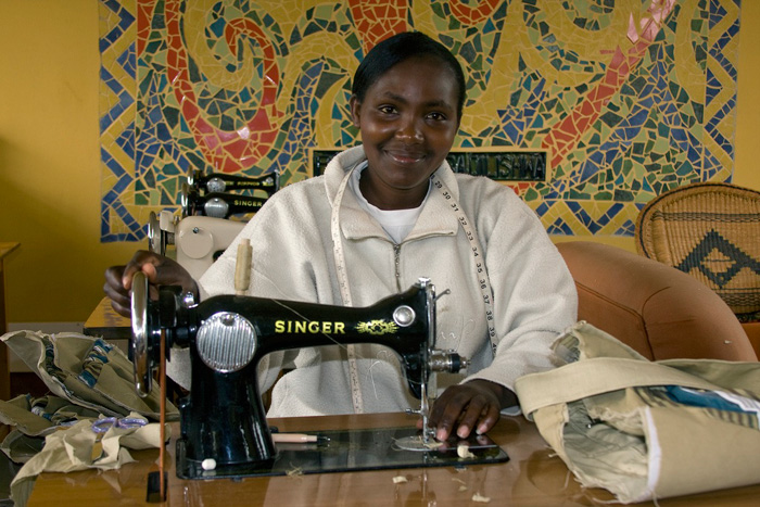 Zipporah stiches with kikoy at the Amani ya Juu center in Kenya