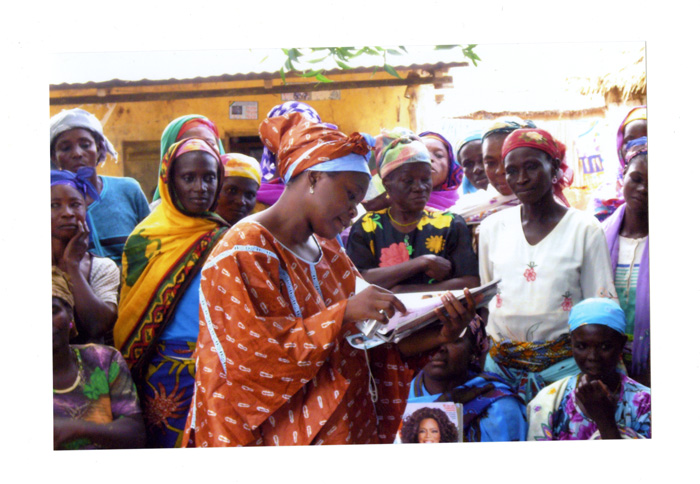 Rahama Wright (center) meets with some of the women in northern Ghana who produce shea butter for cosmetic products