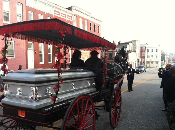 Walter "Teeth" Kelly's coffin was then placed in a hearse for the trip to the cemetery, which is some distance from the church. Photo by James C. Early