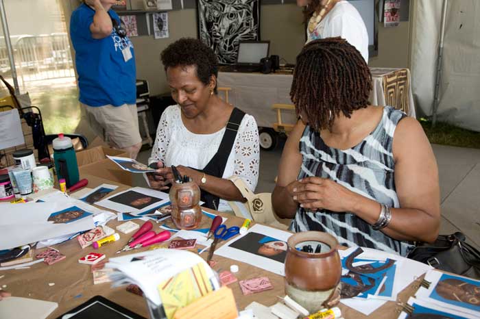 Visitors participate in an activity about Health, Heritage, and Identity in the <i>Will to Adorn</i> program. Photo by Francisco X. Guerra, Ralph Rinzler Folklife Archives