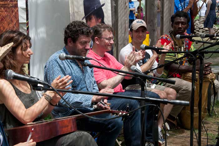 Colombian and Welsh participants from the <i>One World, Many Voices</i> program discuss adaptation and change in the songs of their communities. Photo by Jennifer Graham, Ralph Rinzler Folklife Archives