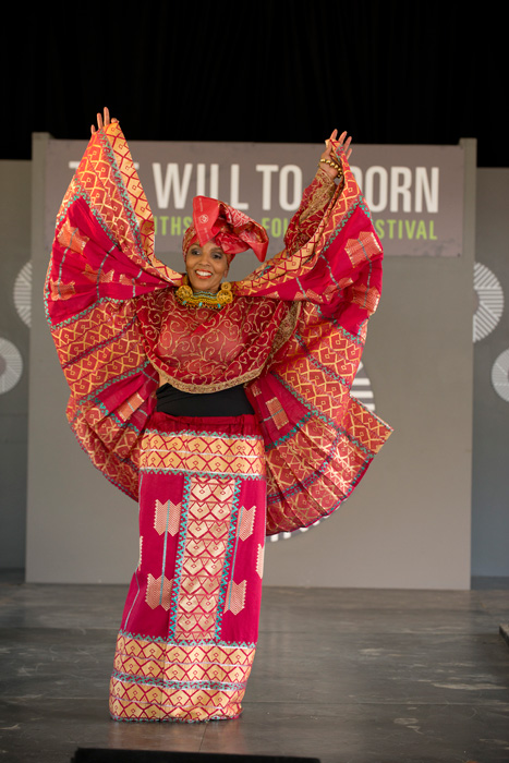 A model in the “Diaspora Inspiration” fashion show on the <i>Will to Adorn</i> program runway. Photo by Walter Larrimore, Ralph Rinzler Folklife Archives