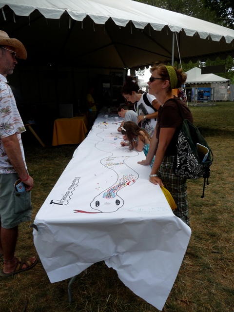  It took seven tables to accommodate the length of the forty-three-foot fossil snake at the Folklife Festival.