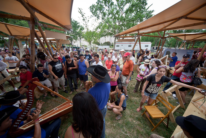 Performers and their audience in the Colombia program area. Photo by Francisco Guerra, Smithsonian Institution