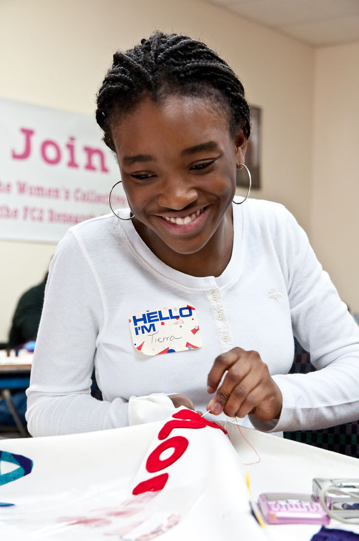 Tierra, whose grandmother is HIV positive, works with children infected with HIV/AIDS. At the Call My Name workshop she sewed names onto a quilt.