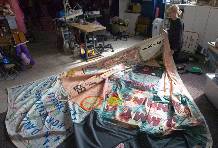 Gert McMullin, one of the original members of the San Francisco quilt-making workshop, repairs a section of The AIDS Memorial Quilt at The NAMES Project Foundation in Atlanta, Georgia.