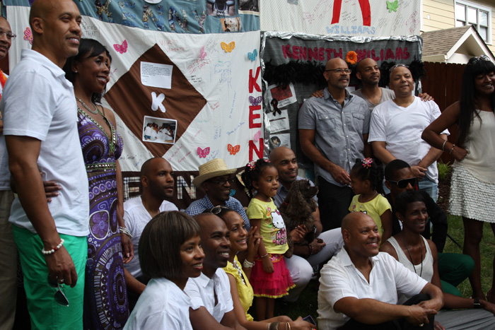 The community of friends gathers in front of the block they made for Kenny Williams.