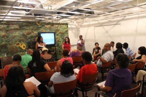 Participant staff Shyra Peyton and Stella Braudy talk to Folklife Festival participants in the pre-orientation.