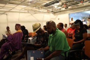 Participants Head Roc and Melani Douglass look through their orientation folders.