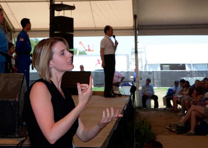 American Sign Language interpreters work at stages throughout each Festival program to make the cultural performances and presentations accessible to all visitors.