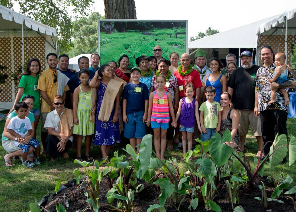 Hawaiian participants pose for a group photograph by their taro plants in the One World, Many Voices program. Photo by Francisco X. Guerra, Ralph Rinzler Archives and Collections, Smithsonian Institution