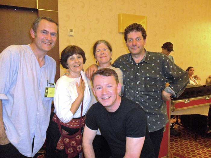 Betty Belanus and Marjorie Hunt gather together with Welsh participants (left to right) Ifor ap Glyn, Owen Saer, and Twm Morys at a Festival party. Photo by Miriam Isaacs