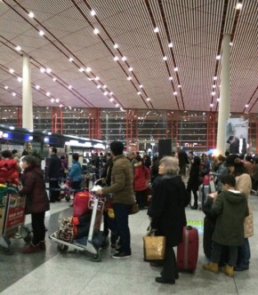 People returning home for Spring Festival line up at Beijing Capital Airport. Photo by Yifei Chen