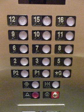 An elevator in a building in China that’s missing its fourth, thirteenth, and fourteenth floors due to number superstitions.