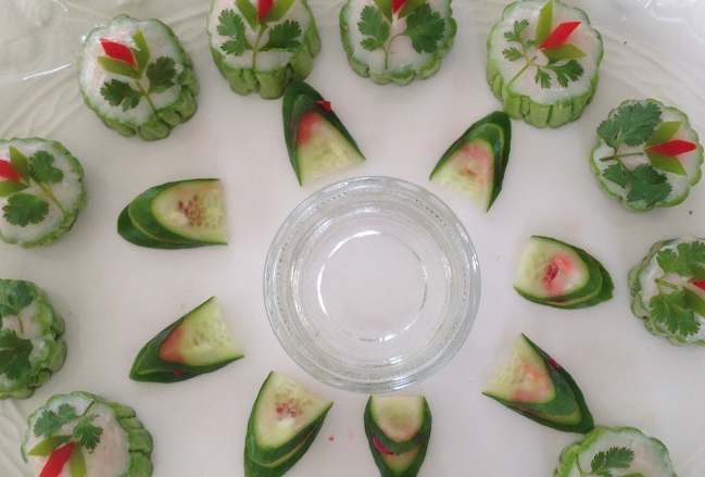 An arrangement of finished bitter squash, fish puree, cucumber, coriander, and bell peppers. Photo by Claire Tian Chen