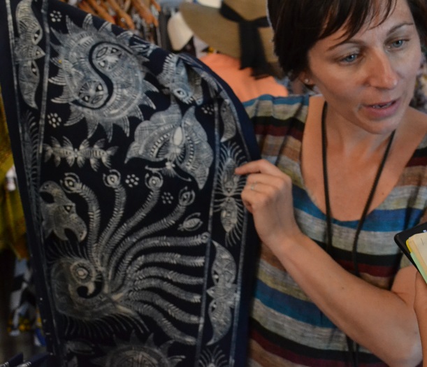 Jackie Flanagan holds up an example of batik printed cloth.