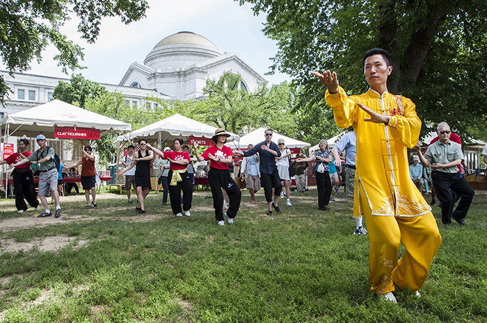 Chai Yunlong leads a tai chi session in People's Park.