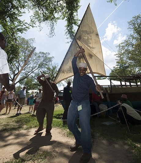 Kenyan participants celebrating the completion of the dhow with song and dance.