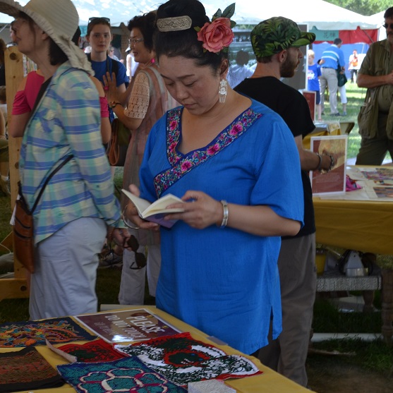 Zhang Hongying is always happy to talk with visitors about her art, either in Chinese or through a volunteer translator.