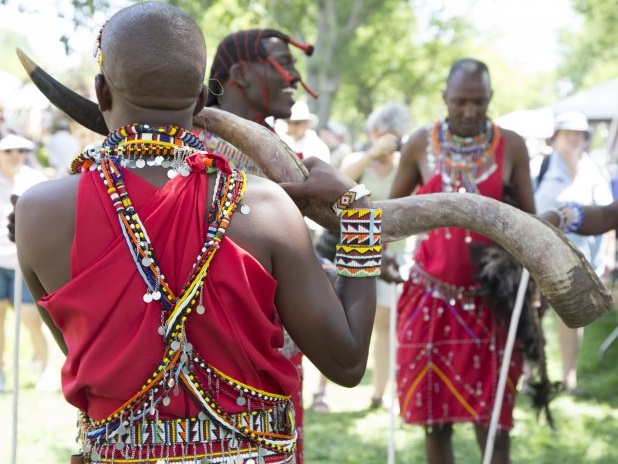 Masaai horn player and dancers.