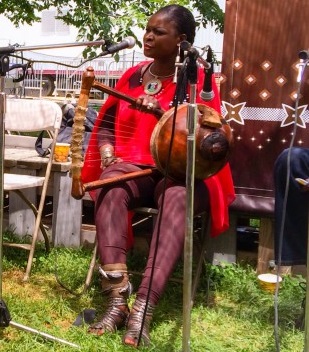Nyatiti player Suzanna Owiyo at the Karibuni Workshops stage.