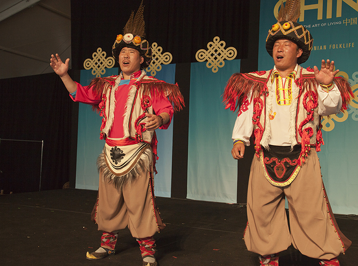 Zewang Renqing and Geluo Zhaxi performing in the Moonrise Pavilion at the 2014 Folklife Festival. Photo by Brian Barger, Ralph Rinzler Folklife Archives