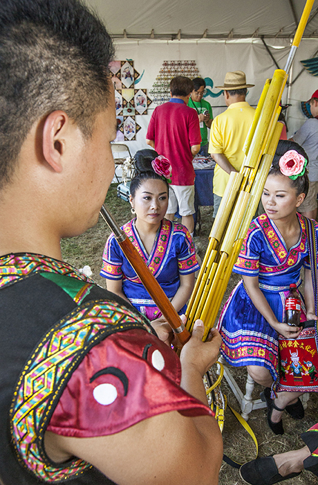 A Miao performer demonstrates the lusheng, a bamboo mouth organ.