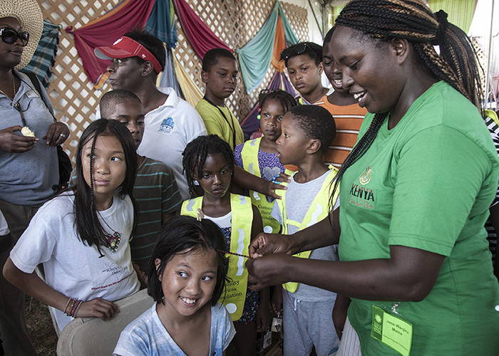 Jane Wanjiru with a group of young summer camp visitors.