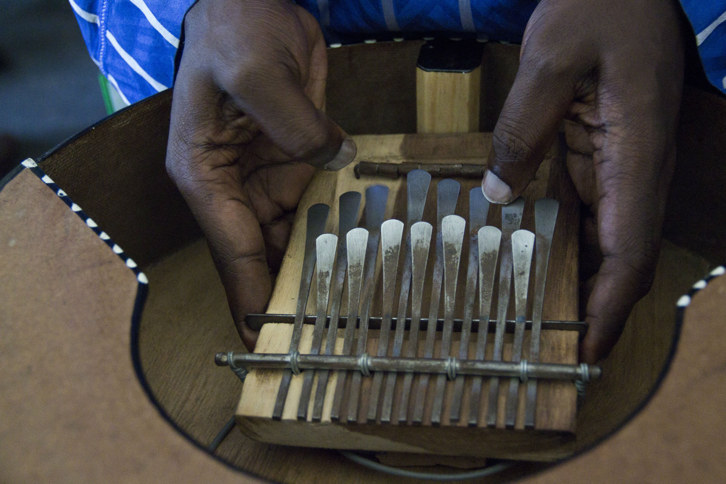 Charles Odero Odemson, better known as Makadem, jams on the kalimba.