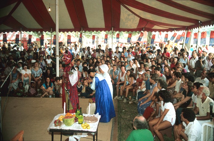 A large audience surrounds the children’s area stage to learn about customs and traditions in the Korean home at the 1982 Smithsonian Folklife Festival. Photo by Jeff Tinsley, Ralph Rinzler Folklife Archives and Collections, Smithsonian Institution