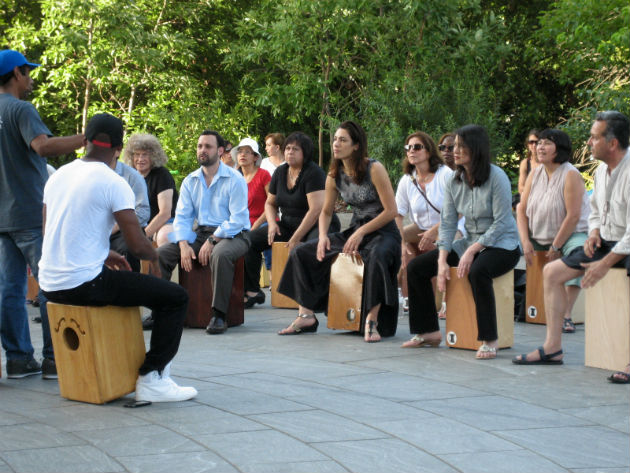 100 Cajoneros rehearse for the Opening Ceremony performance in the National Museum of the American Indian's Welcome Plaza. Photo by Georgia Dassler, Ralph Rinzler Folklife Archives