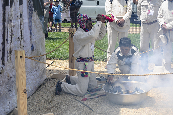 In one of the first events of the day, bridge builders from the Cusco region performed a ritual offering to Apu Q'eswachaka (a mountain spirit), asking permission and blessings in building the Q'eswachaka Bridge over the next two weeks. Photo by Joe Furgal, Ralph Rinzler Folklife Archives