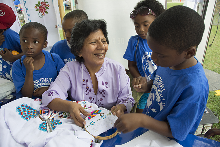  Jacquelina Ayasta showed a youth group her technique for embroidering the dress shirts for Marinera dancers. Photo by Michelle Arbeit, Ralph Rinzler Folklife Archives