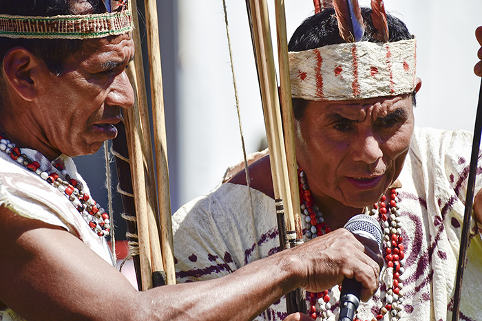 The Wachiperi people of the Peruvian Amazon retain many traditional ways of life, such as wearing clothing made of tree bark and using bows and arrows to hunt. On the Mall, they are demonstrating their archery skills. Photo by Ronald Villasante, Ralph Rinzler Folklife Archives