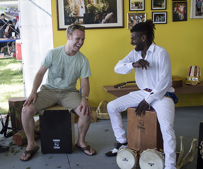 Want to try playing a cajón? Visit the Afro-Peruvian Music and Dance tent, and you are sure to get a lesson! Photo by Sarah Bluestein, Ralph Rinzler Folklife Archives