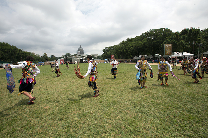 The Fiesta de la Virgen del Carmen dances across the Mall to begin their performance at La Juerga. Photo by Francisco Guerra, Ralph Rinzler Folklife Archives