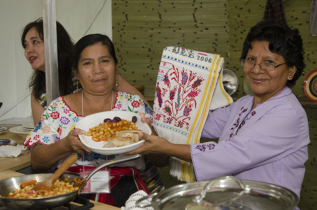 Margarita Guzmán de Gonzales and Jacquie Ayasta are both Marinera artisans and cooks from Monsefú, Peru. They prepared garbanzos norteños in El Fogón Kitchen at the Folklife Festival. Photo by Josh Weilepp, Ralph Rinzler Folklife Archives