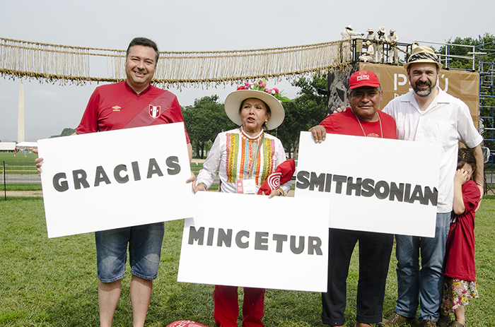 Sunday began with staff and participant photo shoots under the near-complete Q'eswachaka Bridge. Peru Trade Commission director Juan Luis Reus, Ministry of Culture – Moquegua regional director Deisi Rivadeneira, reed raft builder Ángel Piminchumo, Smithsonian Center for Folklife and Cultural Heritage director Michael Mason (and daughter, hidden) posed together. Photo by Josh Weilepp, Ralph Rinzler Folklife Archives