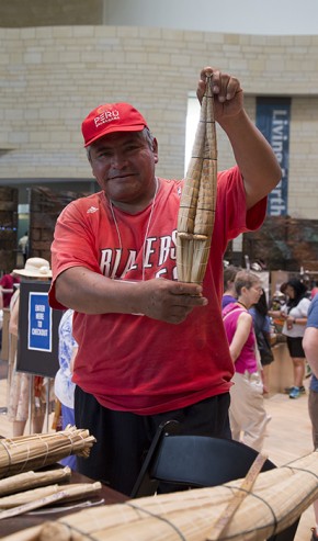 Ángel Piminchumo, a fisherman from Huanchaco, created miniature models of totora reed fishing boats. Photo by Kadi Levo, Ralph Rinzler Folklife Archives