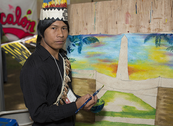 Brus Rubio has been painting away every day, now working on a landscape of the Washington Monument. Photo by Pruitt Allen, Ralph Rinzler Folklife Archives