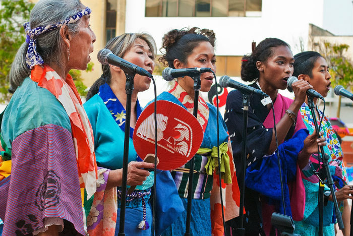 Nobuko Miyamoto, Nancy Sekizawa, Carla Vega, Asiyah Ayubbi, and June Kaewsith perform as <em>FandangObon</em> at the Japanese American Cultural and Community Center in Los Angeles, 2015. Photo by Mike Murase, courtesy of Great Leap, Inc.