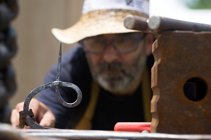 César Alcoz may have the hottest job at the Folklife Festival, working all day over a furnace and with a torch, demonstrating burdinola (ironworking). Photo by Caroline Angelo, Ralph Rinzler Folklife Archives