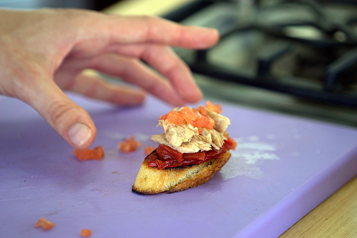 One last <em>pintxo</em> for the road. This one prepared in the Ostatua Kitchen contains pickled onion, tuna, and roasted red pepper on baguette. Photo by Caroline Angelo, Ralph Rinzler Folklife Archives